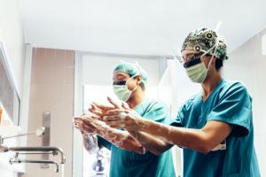 Two doctors washing their hands before a medical procedure